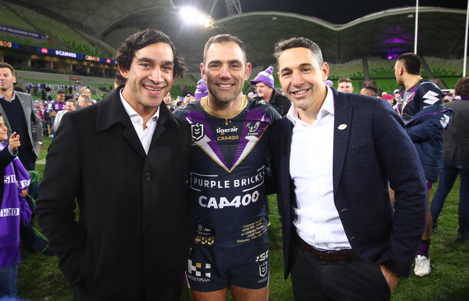 Johnathan Thurston, Cameron Smith and Billy Slater embrace.