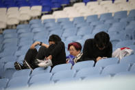 Fans of Japan react after Croatia won in the World Cup round of 16 soccer match between Japan and Croatia at the Al Janoub Stadium in Al Wakrah, Qatar, Monday, Dec. 5, 2022. (AP Photo/Eugene Hoshiko)