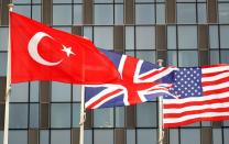 Turkish, British and U.S. flags flutter at NATO headquarters in Brussels