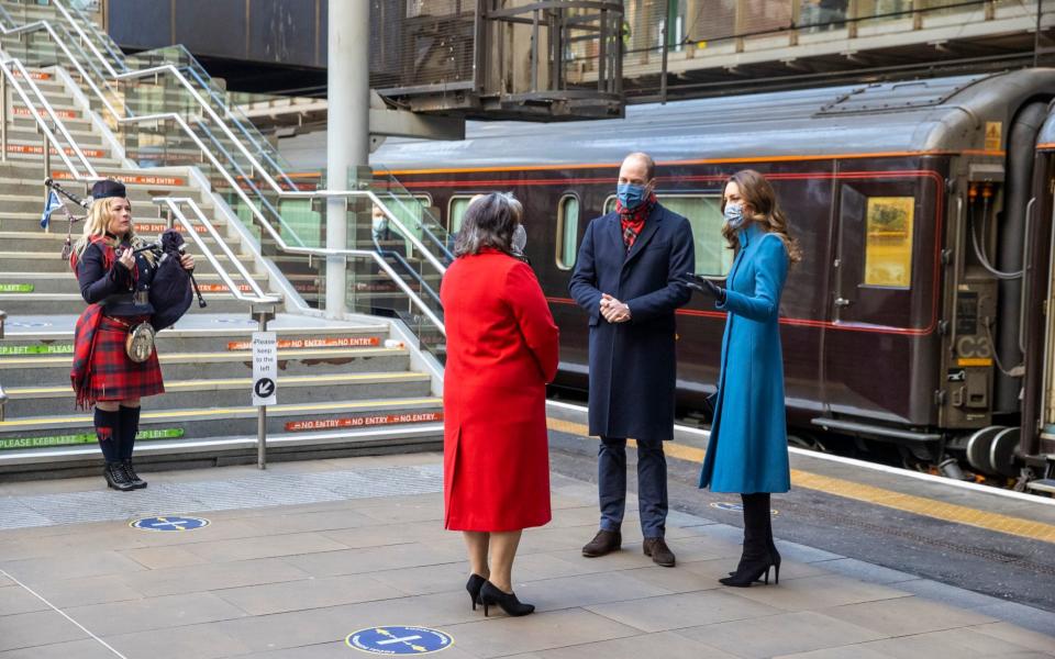 The Cambridges are met by Deputy Lord Lieutenant Sandra Cumming and piper Louise Marshall at Edinburgh Waverley Station - Andy Barr/PA