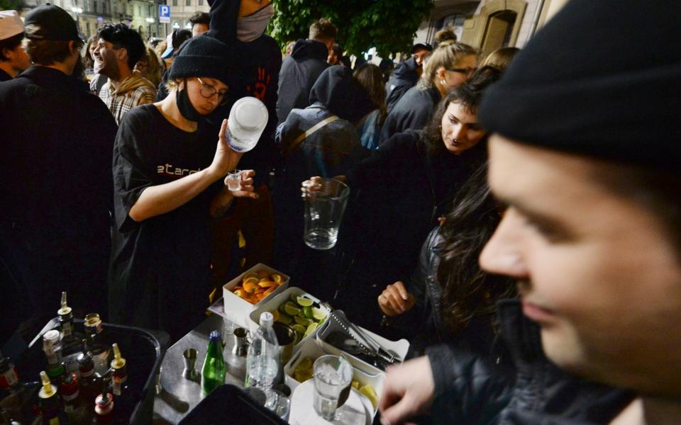 People gather and celebrate as bars, clubs and other establishments reopened in Poland after being closed for seven months, in Warsaw, Poland -  Czarek Sokolowski / AP