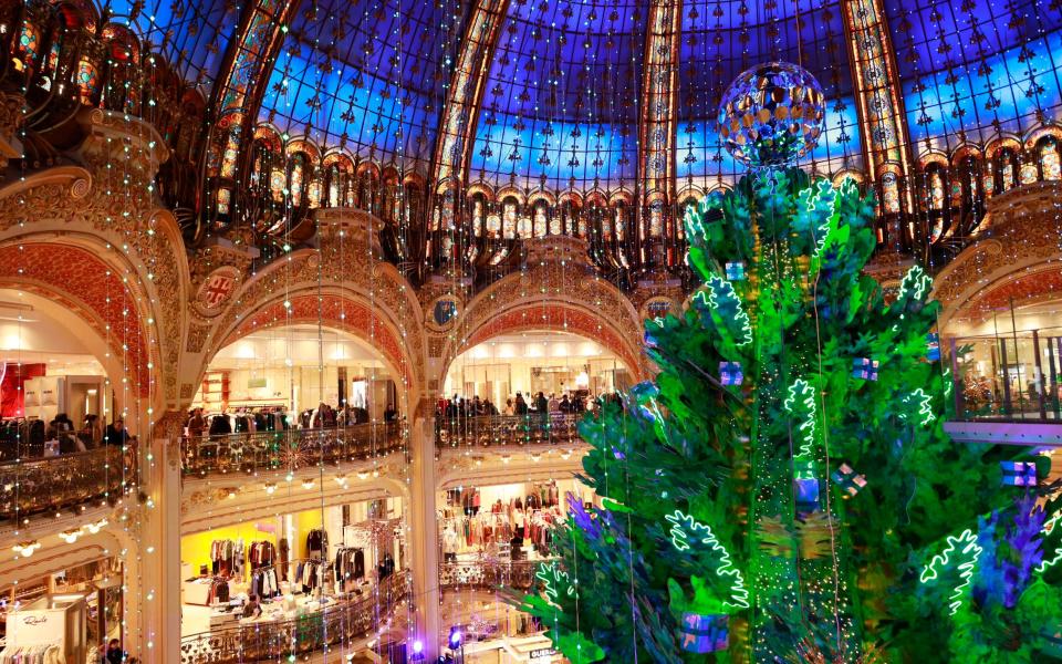 Christmas tree Galeries Lafayette shopping in paris holidays travel - Getty