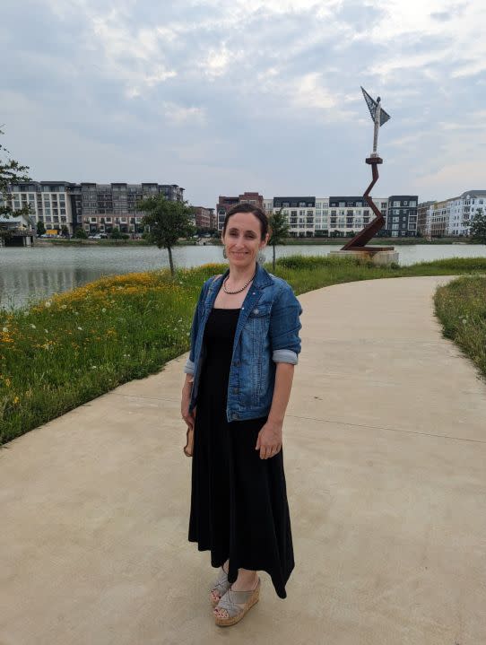 
           woman on a path by the river

        