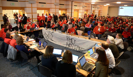 Representatives from the Denver Classroom Teachers Association and Denver Public Schools restart contract negotiations as teachers strike for a second day in Denver, Colorado, U.S., February 12, 2019. REUTERS/Michael Ciaglo