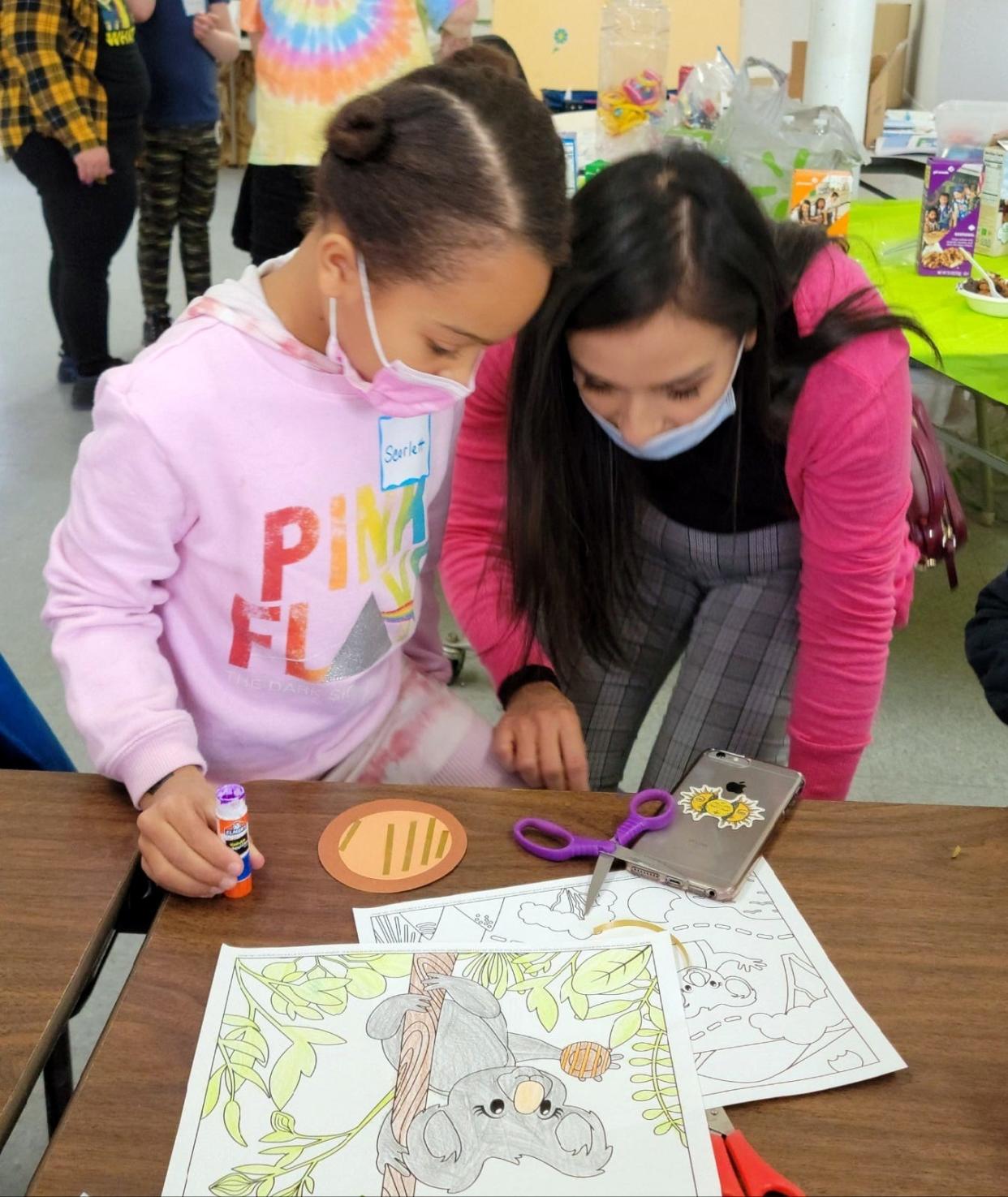 Angela Amaya helped her daughter Scarlett Claudio make a cookie nametag. during last Saturday's Girl Scout Cookie Kick-Off Party at the Deming Scout Hut.