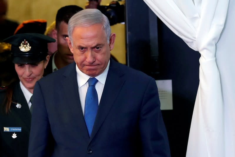 FILE PHOTO:Israeli Prime Minister Benjamin Netanyahu looks on as he arrives to review an honor guard with his Ethiopian counterpart Abiy Ahmed during their meeting in Jerusalem