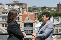 In this May 21, 2021, photo overlooking the Dupont Circle neighborhood, Washington based civil rights attorneys Lisa Banks, left, and Debra Katz chat after a portrait session at their law firm in Washington. For many people, the pandemic year has brought a pause of some kind, or at least a slowdown, to their professional endeavors. For Katz and Banks, the opposite has been true. “This is probably the biggest year we’ve ever had,” says Banks. Their work has been increasing for nearly four years. When the Harvey Weinstein revelations erupted in October 2017, launching the reckoning that became known as the #MeToo movement, it caused “a sea change," Katz says. (AP Photo/Jacquelyn Martin)