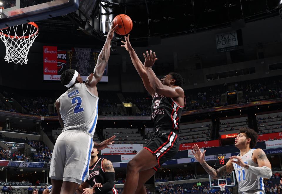 MEMPHIS, TN - NOVEMBER 19: Jalen Duren #2 of the Memphis Tigers blocks a shot attempt by Jairus Hamilton #3 of the Western Kentucky Hilltoppers during a game on November 19, 2021 at FedExForum in Memphis, Tennessee. Memphis defeated Western Kentucky 74-62