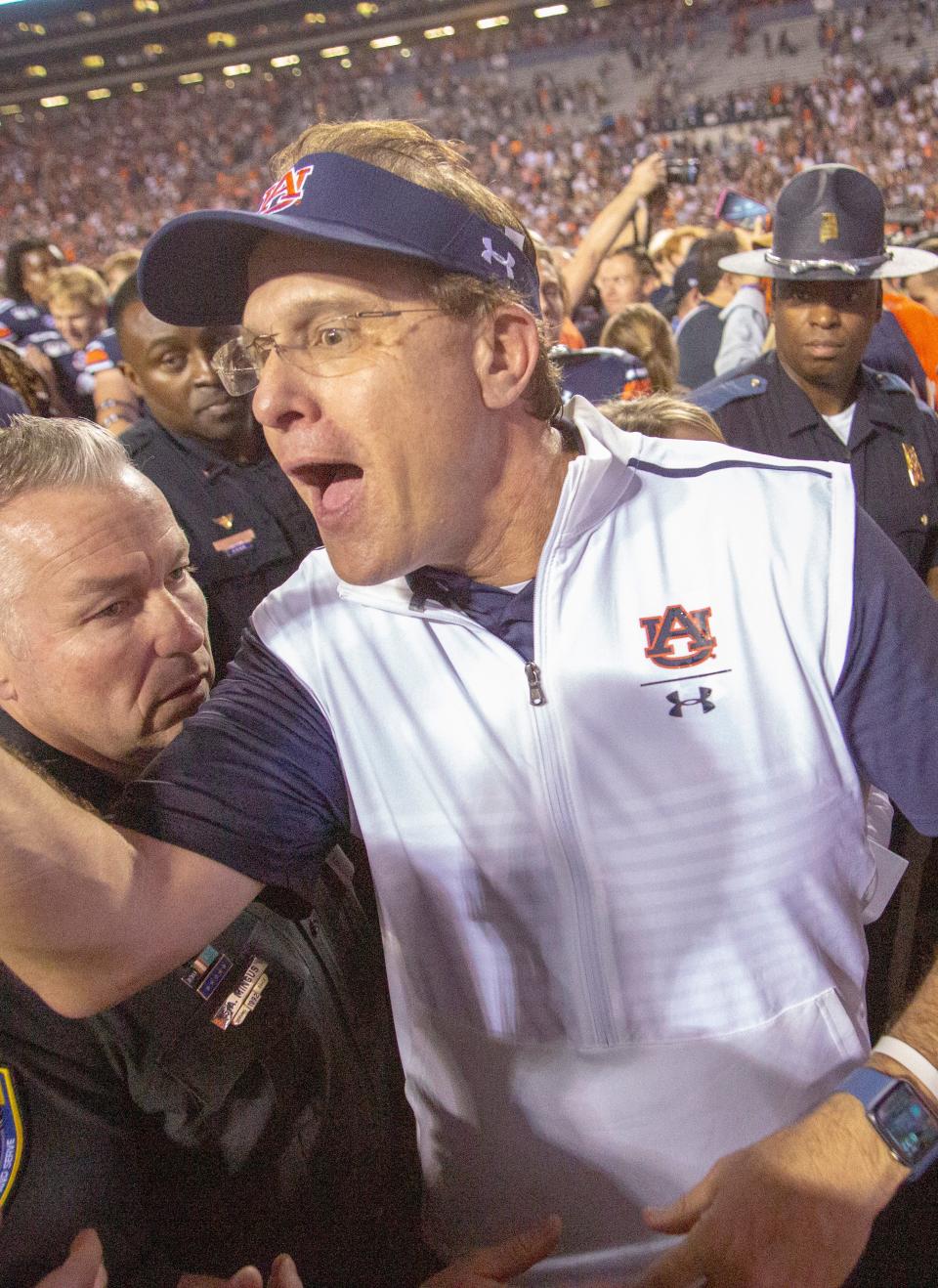 Auburn head coach Gus Malzahn shakes hands with fans after the Tigers defeated Alabama 48-45 in the 2019 Iron Bowl.