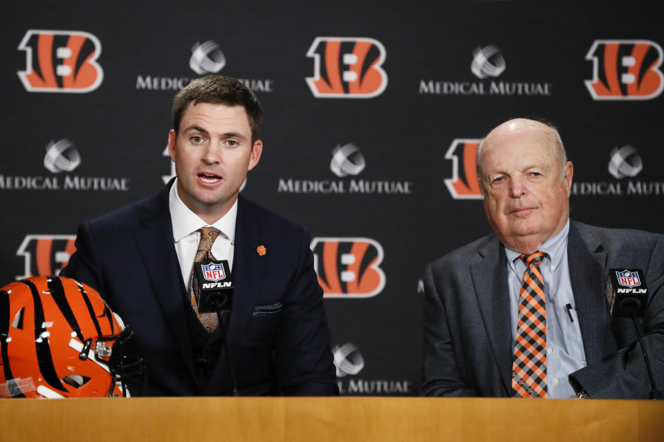 Cincinnati Bengals football head coach Zac Taylor, left, speaks alongside Bengals owner Mike Brown, right, during a news conference, Tuesday, Feb. 5, 2019, in Cincinnati. After 16 years without a playoff win under Marvin Lewis, the Bengals decided to try something different. But they had to wait more than a month before hiring Zac Taylor as their next coach in hopes of ending a long streak of futility. (AP Photo/John Minchillo)