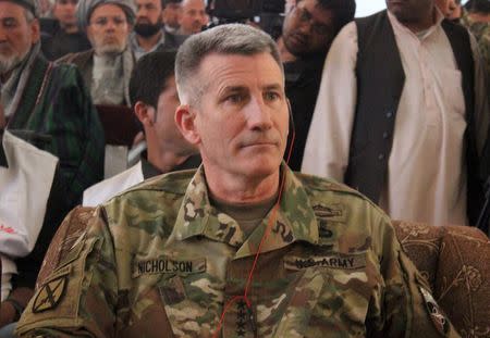 The commander of U.S. and NATO forces in Afghanistan General John W. Nicholson sits during his visits from Kunduz province, Afghanistan, March 22, 2016. REUTERS/Stringer/Files