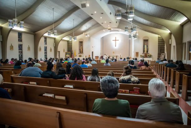 Uvalde residents gather at Sacred Heart Church to pray after Tuesday’s school shooting at Robb Elementary School. (Sergio Flores for The Texas Tribune)