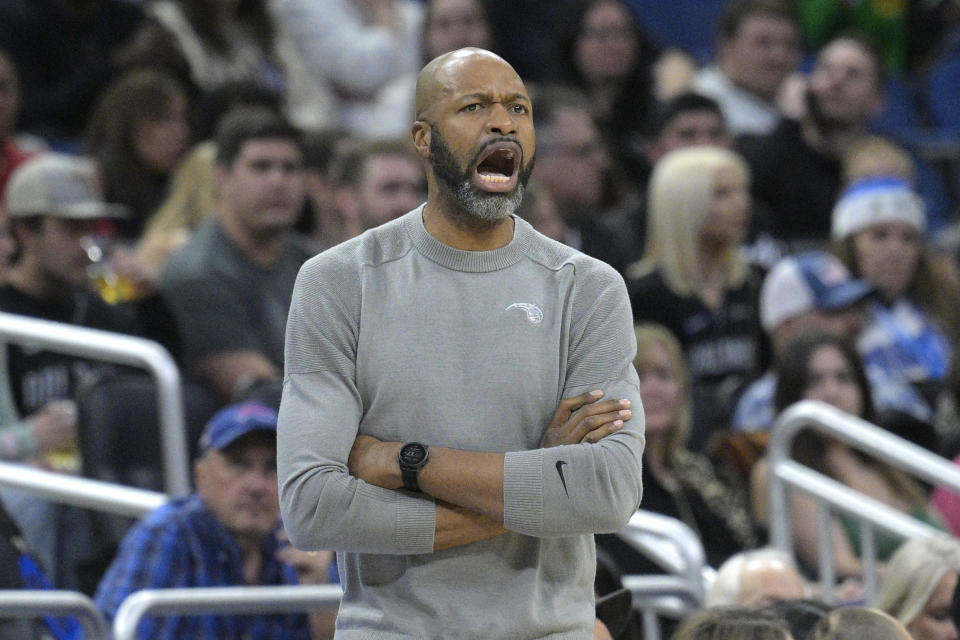 Orlando Magic coach Jamahl Mosley calls out instructions during the first half of the team's NBA basketball game against the San Antonio Spurs, Friday, Dec. 23, 2022, in Orlando, Fla. (AP Photo/Phelan M. Ebenhack)