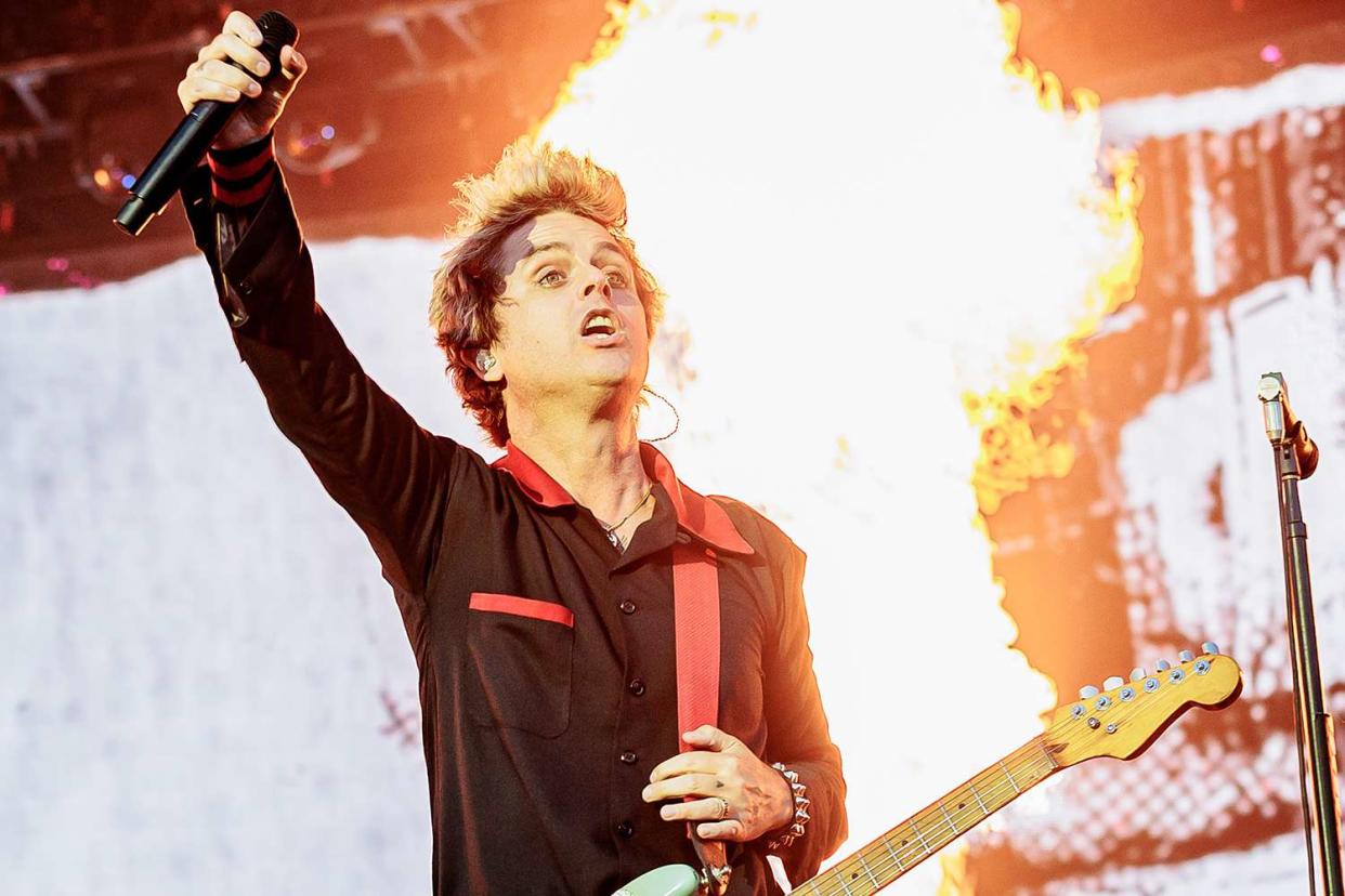 <p>Sergione Infuso/Corbis via Getty</p> Billie Joe Armstrong of Green Day performs in Milan in June 2024