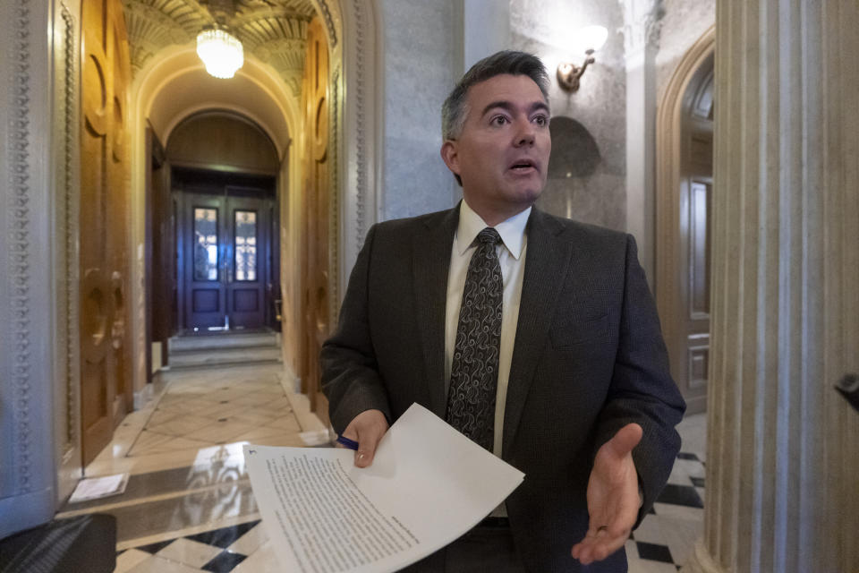 FILE - In this Dec. 31, 2018, file photo, Sen. Cory Gardner, R-Colo., arrives at the Senate Chamber for an abbreviated pro-forma session at the Capitol in Washington. The headquarters of the U.S. government's largest land agency will move from the nation's capital to western Colorado, a Republican senator said Monday, July 15, 2019, a high-profile component of the Trump administration's plan to reorganize management of the nation's natural resources. (AP Photo/J. Scott Applewhite, File)