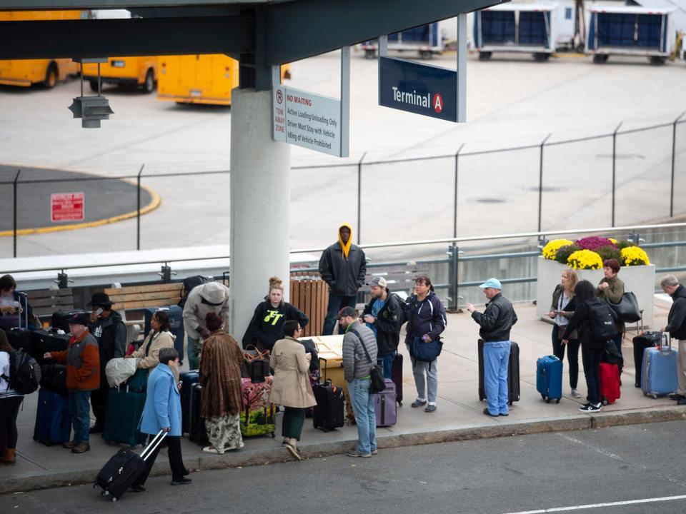 People waiting outside at Bradley International Airport, Hartford, Connecticut.