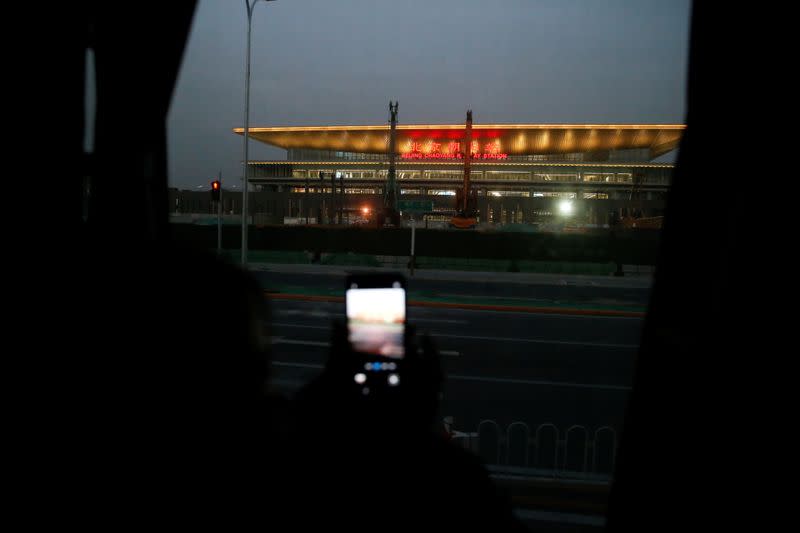 The Wider Image: 'I've let them down': Beijing's migrant workers miss family reunions on Lunar New Year