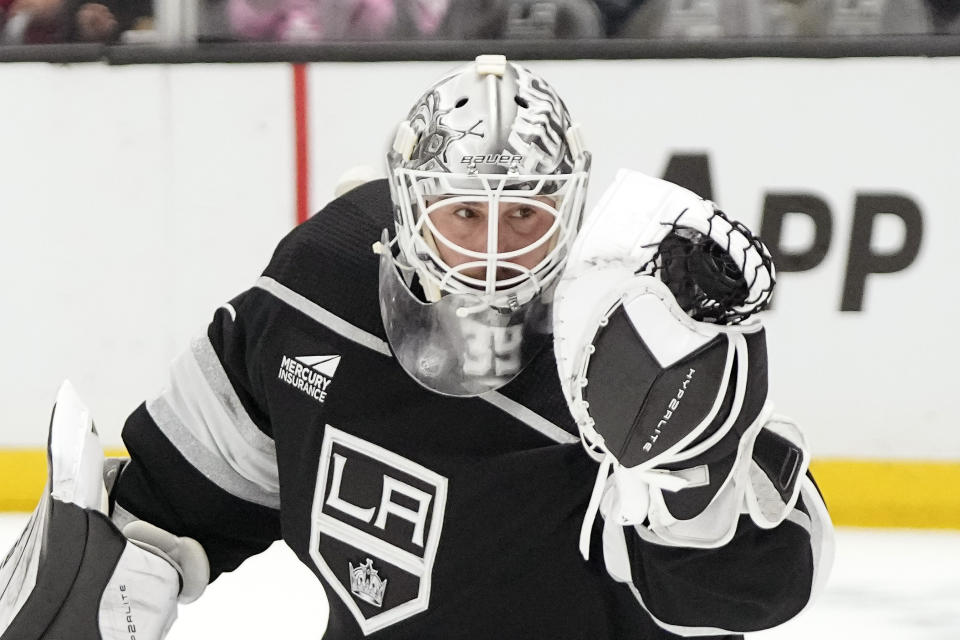 Los Angeles Kings goaltender Cam Talbot makes a glove save during the first period of an NHL hockey game against the St. Louis Blues Saturday, Nov. 18, 2023, in Los Angeles. (AP Photo/Mark J. Terrill)