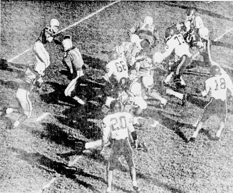 In this Times Record News file photo from Nov. 28, 1964, Hirschi quarterback Ronnie Faulkner (11) pitches the ball to Lindy Hempling in a playoff game against Sweetwater. At right, Don King (75) leads the blocking.