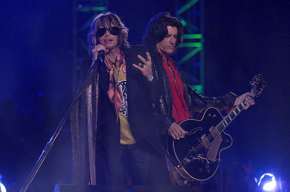 28 Jan 2001:  Steven Tyler and Aerosmith perform during the halftime show for Super Bowl XXXV at Raymond James Stadium in Tampa, Florida.  DIGITAL IMAGE. Mandatory Credit: Brian Bahr/ALLSPORT