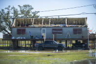 A house is damaged from Hurricane Zeta in Cocodrie, La., Thursday, Oct. 29, 2020. Gov. John Bel Edwards says officials are still assessing the extent of Zeta’s damage across the southeastern parishes. (Chris Granger/The Advocate via AP)