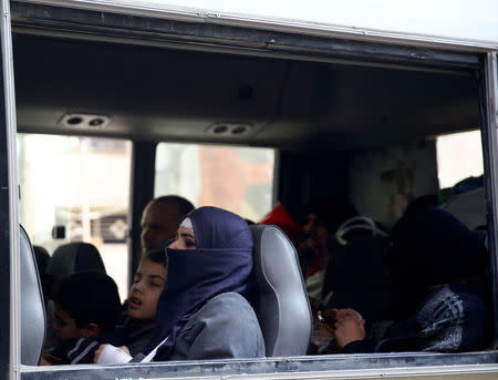 Civilians are seen in a bus during evacuation from the besieged town of Douma, Eastern Ghouta, in Damascus, Syria, March 13. REUTERS/Bassam Khabieh