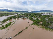 <p>After record rainfall in the area <a href="https://apnews.com/article/climate-floods-montana-and-environment-4bdc704074dfe199b3e6f3c5c9e402b0?utm_campaign=SocialFlow&utm_source=Twitter&utm_medium=AP" rel="nofollow noopener" target="_blank" data-ylk="slk:created hazardous conditions" class="link ">created hazardous conditions</a> — including flooding, mudslides, rockfalls, and road and bridge failures, officials <a href="https://people.com/human-interest/yellowstone-closes-entranes-extreme-flooding-photos/" rel="nofollow noopener" target="_blank" data-ylk="slk:closed of the Yellow Stone National Park entrances" class="link ">closed of the Yellow Stone National Park entrances</a> in Montana and Wyoming to inbound traffic on June 14. </p> <p>Pictured: Flooding is seen on June 14 in Livingston, Montana after the Yellowstone River hit a historic high. </p>