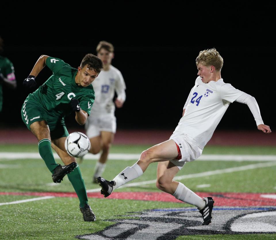 Cornwall's Andrew Bonet bounces a pass off Goshen's Parker Warren during the Section 9 Class AA championship on October 30, 2023.