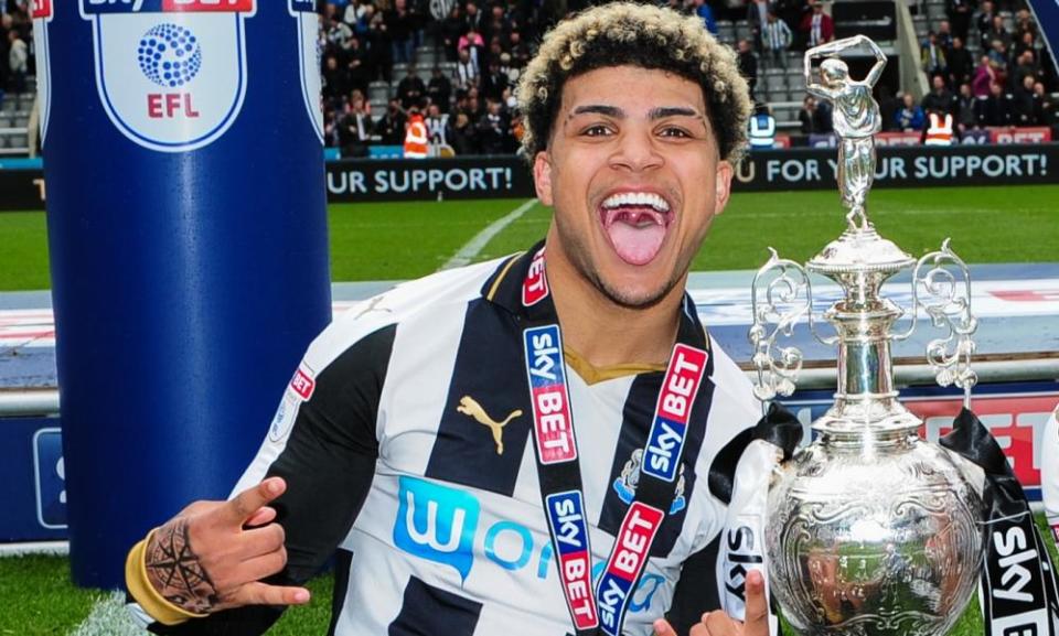 DeAndre Yedlin celebrates with the trophy after winning the Championship title. 