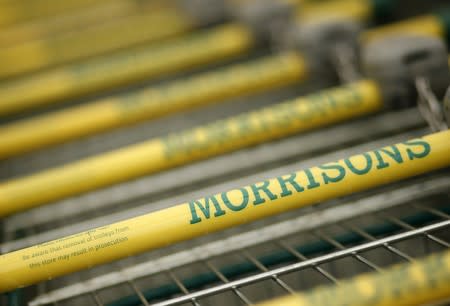 Shopping trolleys stand outside a Morrisons supermarket in Liverpool, northern England