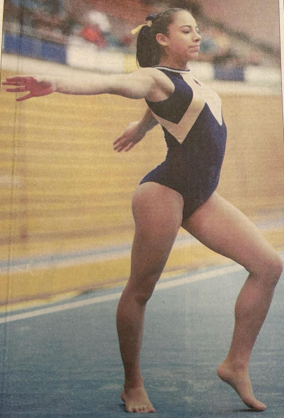 Vicky Bull, now Watertown High School gymnastics coach Vicky Fisher, is shown in the floor exercise during the 2002 Watertown Invitational gymnastics meet in the Civic Arena.