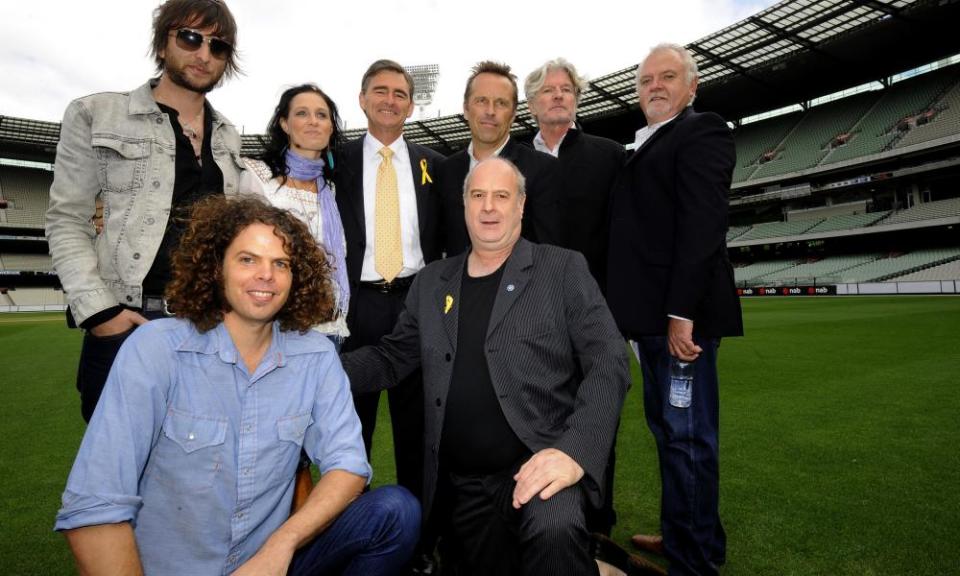 Michael Gudinski (bottom right) with (L-R) Nic Cester (Jet), Andrew Stockdale (Wolfmother), Kasey Chambers, Victorian premier John Brumby, Mark Seymour (Hunters & Collectors), Tim Finn and Mark Pope at the MCG in Melbourne in February 2009.