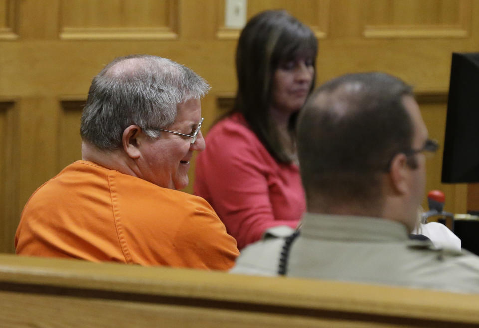 Bernie Tiede smiles as he talks to his attorney during a break in a court hearing granting his release at the Panola County court house in Carthage, Texas, Tuesday, May 6, 2014. The former mortician whose killing of a rich widow shook an East Texas town and later inspired a movie will soon go free, after the district attorney who prosecuted him agreed Tuesday to let him out of a life sentence. (AP Photo/LM Otero)