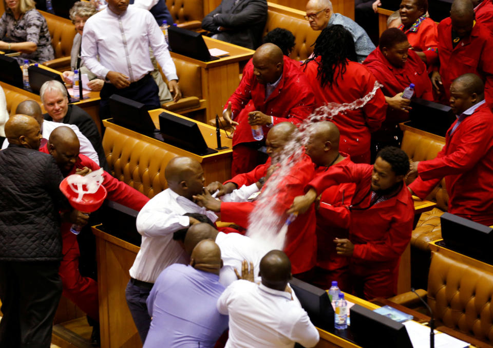 <p>Party leader Julius Malema and members of his Economic Freedom Fighters clash with parliamentary security as they are evicted from the chamber in Cape Town, South Africa, on May 17, 2016. (Mike Hutchings/Reuters)</p>