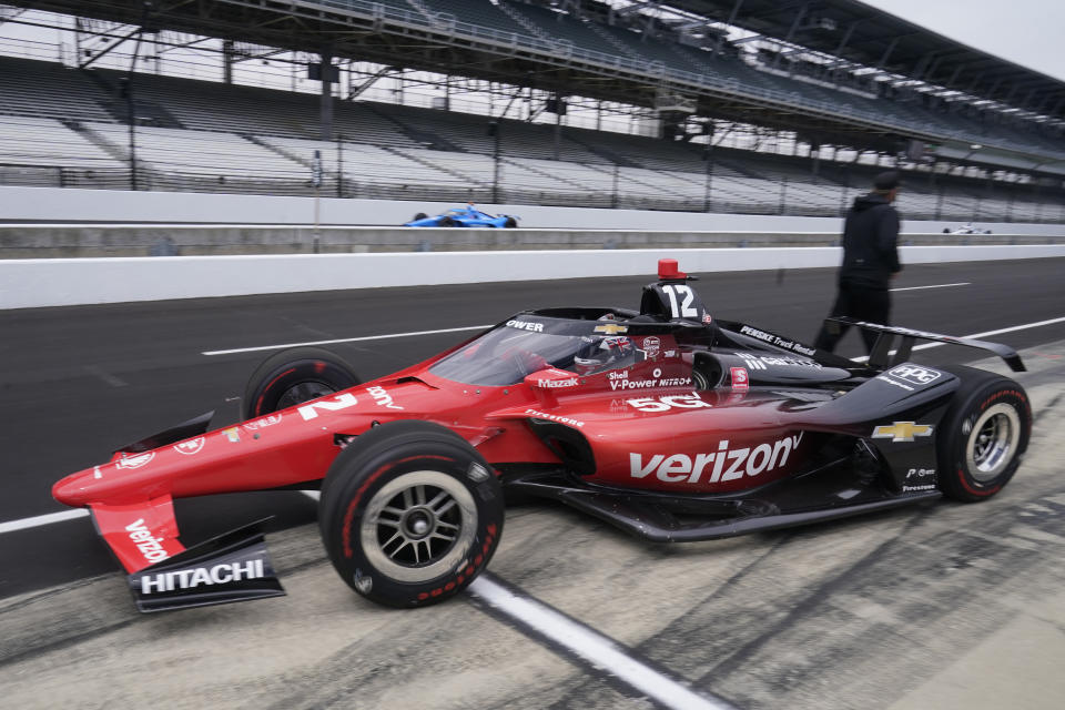 Will Power, of Australia, pulls out of the pits during IndyCar auto racing testing at Indianapolis Motor Speedway, Wednesday, April 20, 2022, in Indianapolis. (AP Photo/Darron Cummings)