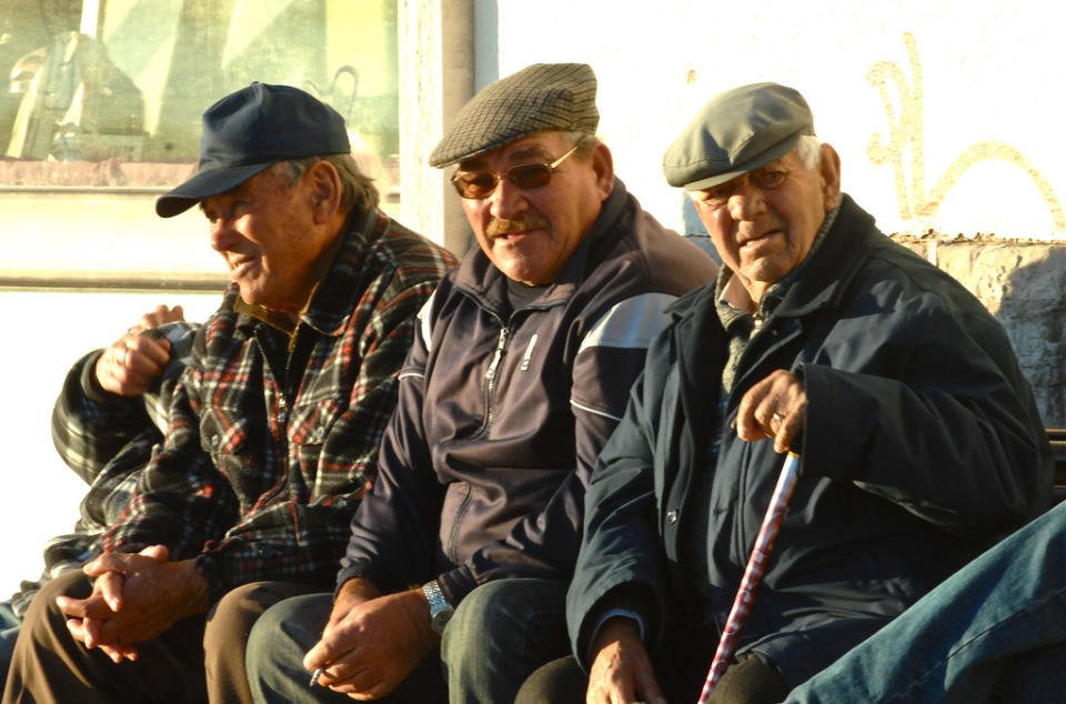 Men on a bench.