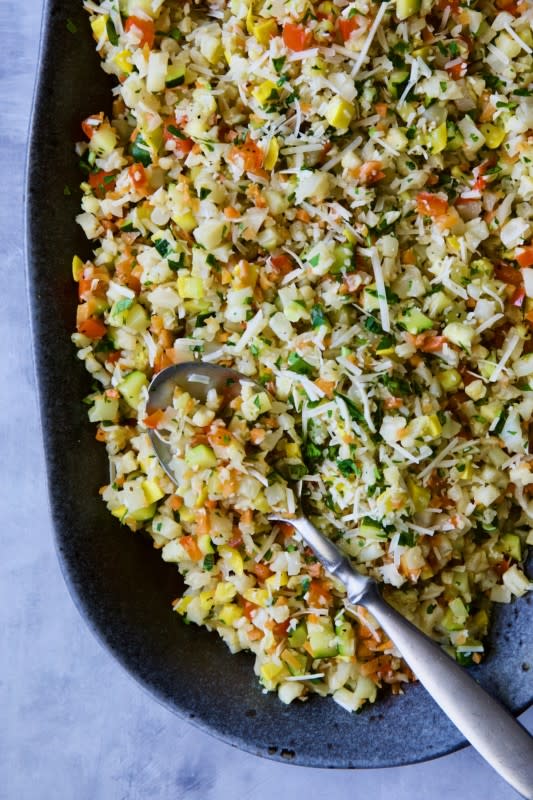 <p>From a Chef's Kitchen</p><p>Take cauliflower rice up another level! The method for how to cook riced cauliflower in the oven can also be used to make this Roasted Riced Vegetables with Garlic and Parmesan with cauliflower, carrots, sweet bell pepper, zucchini and yellow squash that’s festive and simply delicious!</p><p><strong>Get the recipe: <a href="https://www.fromachefskitchen.com/roasted-riced-vegetables-garlic-parmesan/" rel="nofollow noopener" target="_blank" data-ylk="slk:Roasted Riced Vegetables with Garlic and Parmesan;elm:context_link;itc:0;sec:content-canvas" class="link rapid-noclick-resp">Roasted Riced Vegetables with Garlic and Parmesan</a></strong></p>