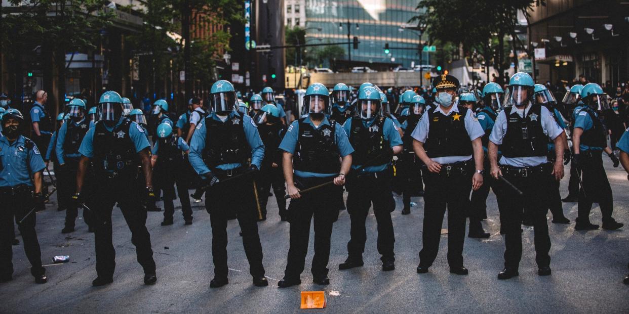 Police force at the Chicago protests for George Floyd , on May 30, 2020 during a protest against the death of George Floyd, an unarmed black man who died while while being arrested and pinned to the ground by the knee of a Minneapolis police officer.