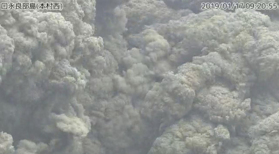 In this image from a surveillance camera released by Japan Meteorological Agency, a smoke column rises after an eruption of Shindake volcano in Kuchinoerabu island, southern Japan, Thursday, Jan. 17, 2019. Japan Meteorological Agency said Thursday’s eruption of Shindake volcano caused volcanic rocks flying out of the crater and pyroclastic flows pouring down but have not reached as far as the residential area 2 kilometers (1.2 mile) away. (Japan Meteorological Agency via AP)