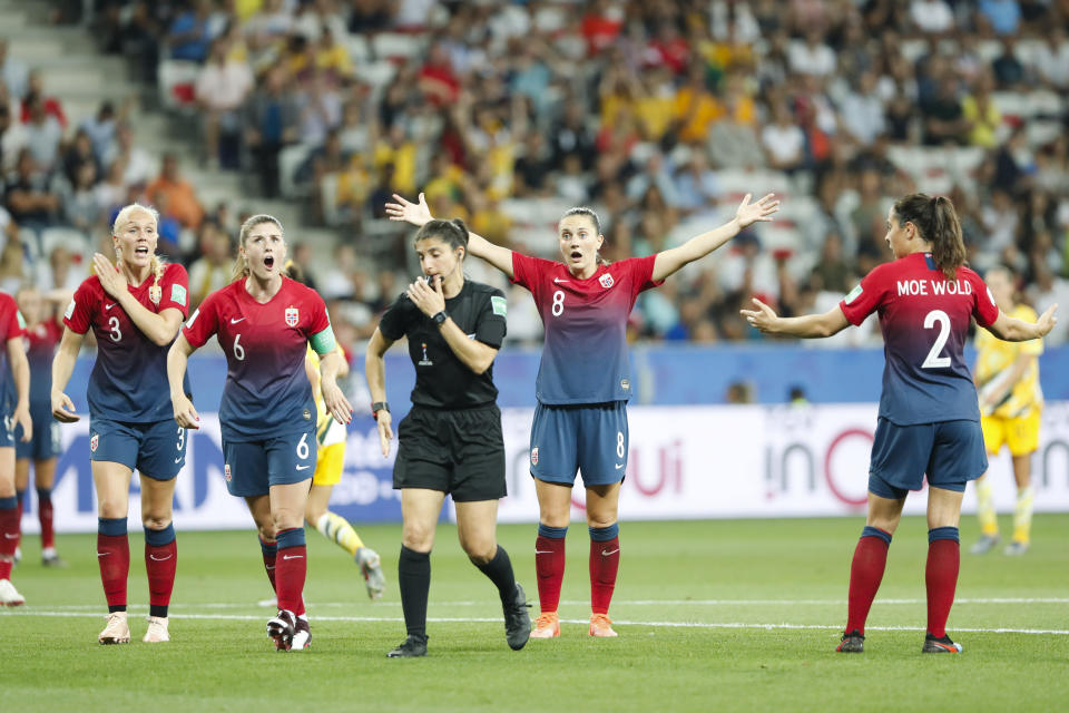 Norway players complain to referee Riem Hussein during the Women's World Cup round of 16 soccer match between Norway and Australia at the Stade de Nice in Nice, France, Saturday, June 22, 2019. (AP Photo/Thibault Camus)