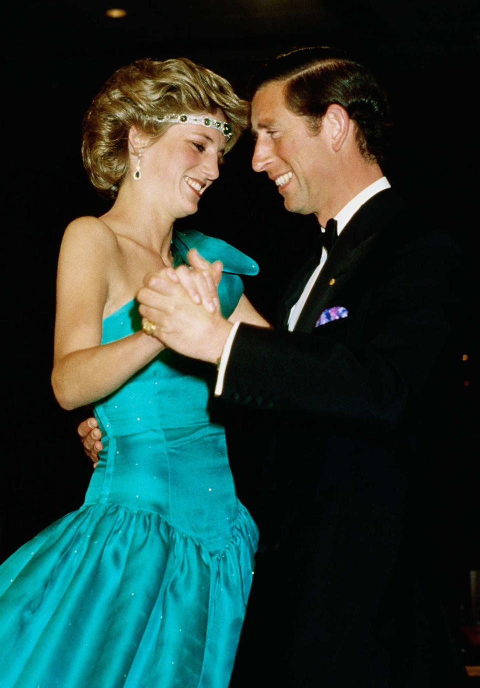 Princess Diana and Prince Charles dance at a formal event