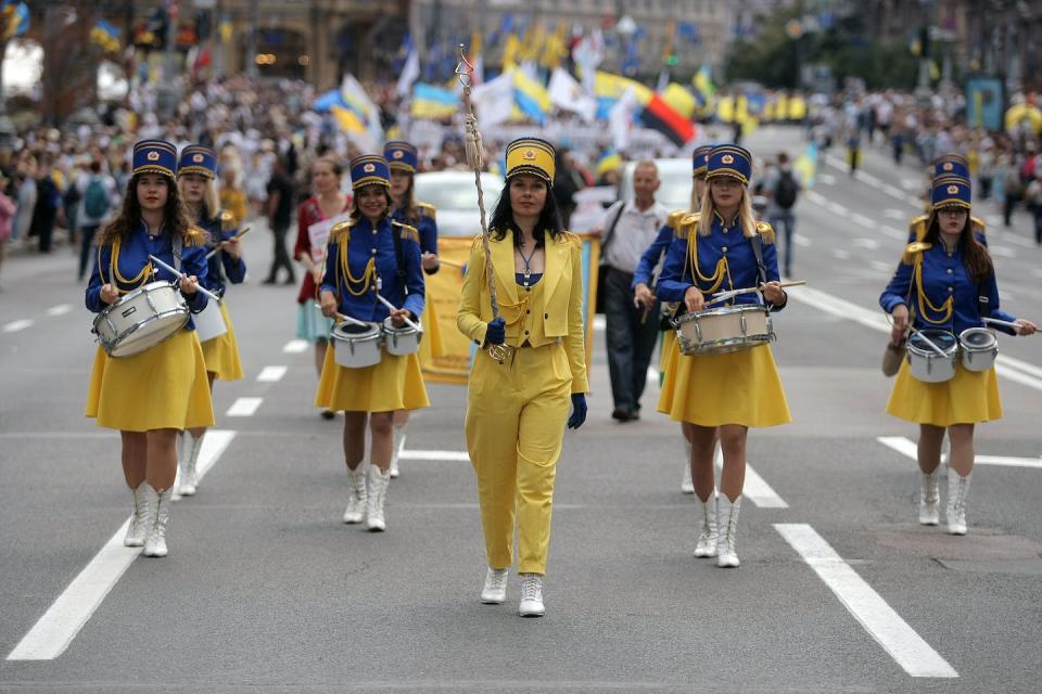 A marching band participates in the Ukraine’s Independence Day celebration in August 2021. <a href="https://media.gettyimages.com/photos/drum-major-leads-a-marching-band-dressed-in-national-colours-during-picture-id1234858388?s=2048x2048" rel="nofollow noopener" target="_blank" data-ylk="slk:Evgen Kotenko/ Ukrinform/Future Publishing via Getty Images;elm:context_link;itc:0;sec:content-canvas" class="link ">Evgen Kotenko/ Ukrinform/Future Publishing via Getty Images</a>