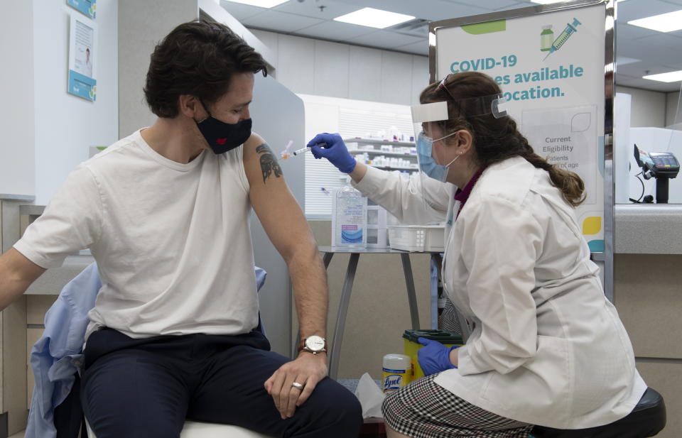 Prime Minister Justin Trudeau receives his first COVID vaccination in Ottawa, Friday April 23, 2021. (Adrian Wyld/The Canadian Press via AP)