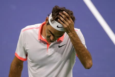 Roger Federer of Switzerland reacts after losing a point to Novak Djokovic of Serbia during their men's singles final match at the U.S. Open Championships tennis tournament in New York, September 13, 2015. REUTERS/Lucas Jackson