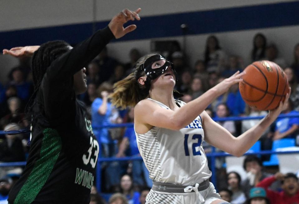Olton's Kylee Noack, right, prepares to shoot a field goal against Floydada in a District 4-2A girls basketball game, Friday, Jan. 13, 2023, at Olton Memorial Gymnasium in Olton.