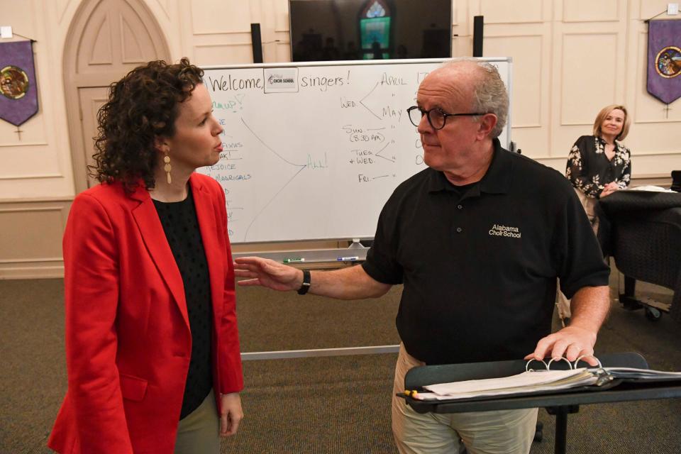 April 17, 2024; Tuscaloosa, AL, USA; Doff Procter and his wife Laurel are retiring from directing the Alabama Choir School. New director Leah Durham confers with Doff Procter during rehearsal.