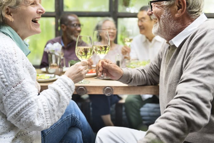 Mature couple toasting champagne