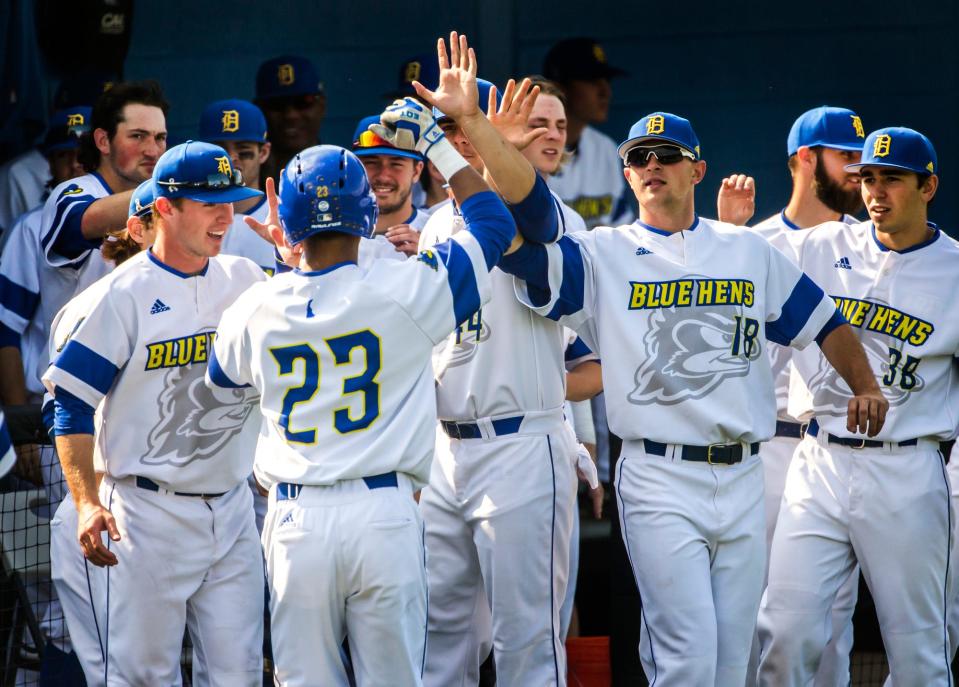 Delaware's Jordan Glover (No. 23) is congratulated by teammates after a home run in a 2016 game.