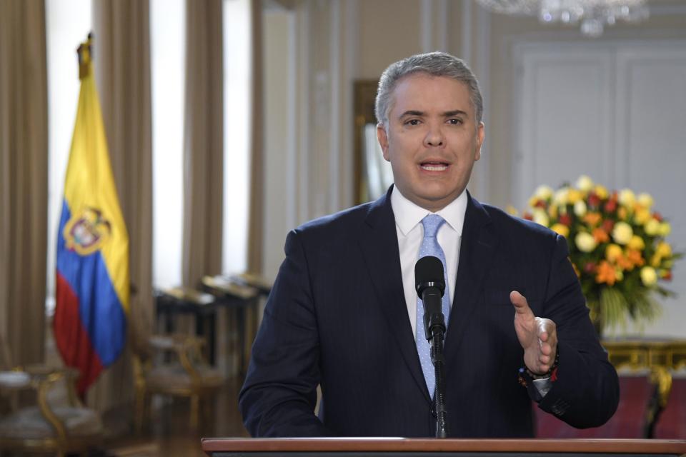 In this photo released by the Colombia's Presidential Press Office, President Ivan Duque gives a statement at Palacio de Narino in Bogota, Colombia, Thursday, Aug. 29, 2019. Duque is lashing out against Venezuelan President Nicolas Maduro for allegedly providing safe haven to a cadre of demobilized Revolutionary Armed Forces of Colombia rebel leaders who announced they are rearming. (Efrain Herrera/Colombia's Presidential Press Office via AP)