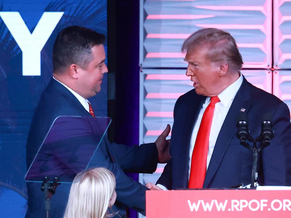 Florida GOP chairman Christian Ziegler shakes hand with Donald Trump.